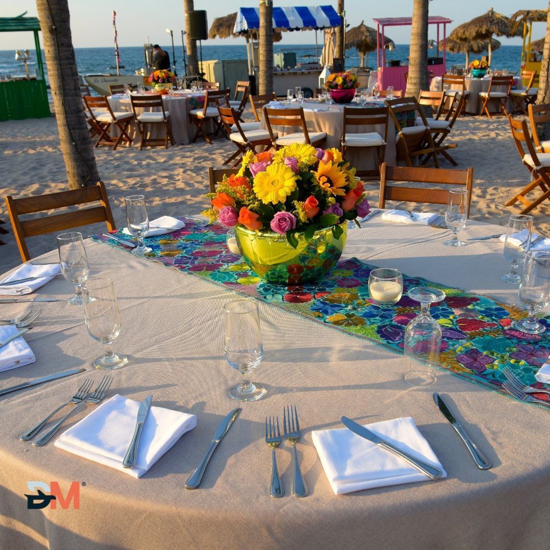 A table with a bowl of flowers on it