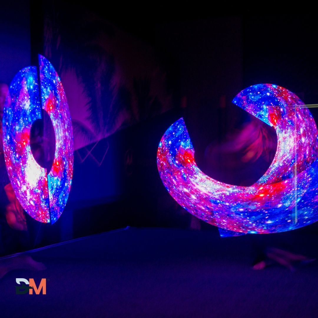 A pair of glow in the dark rings with a cm logo in the corner