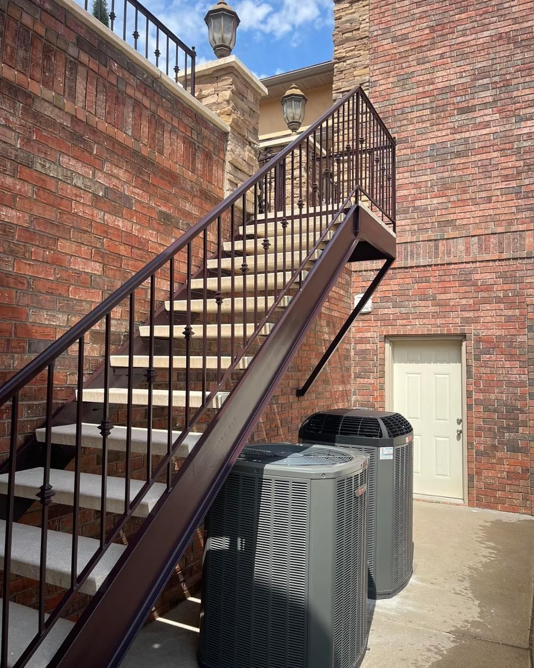 A set of stairs leading up to a brick building