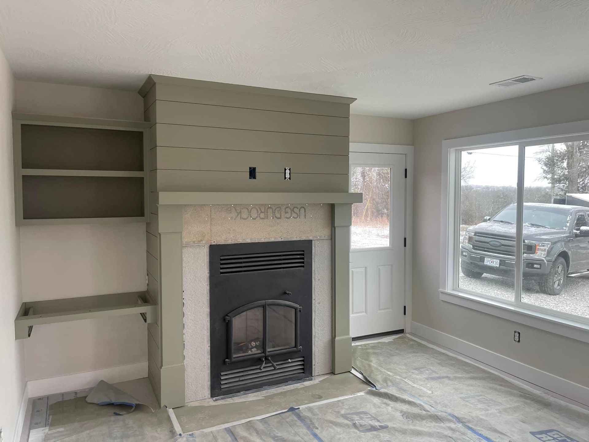 There is a fireplace in the middle of the room.