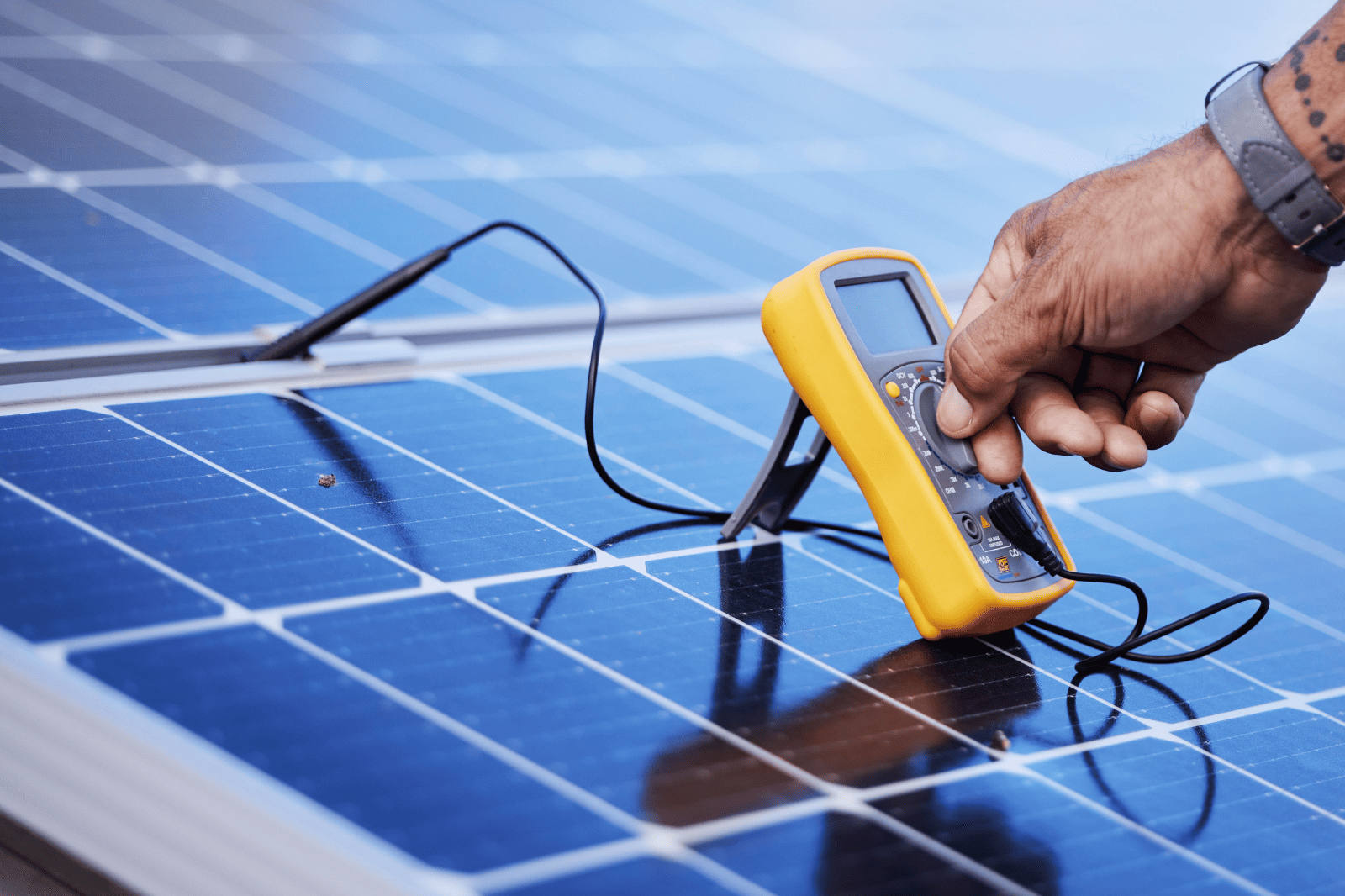 A Person is Working on a Solar Panel With a Drill and Sander — B2B Electrical and Solar In Currimundi, QLD A Person is Working on a Solar Panel With a Drill and Sander — B2B Electrical and Solar In Currimundi, QLD