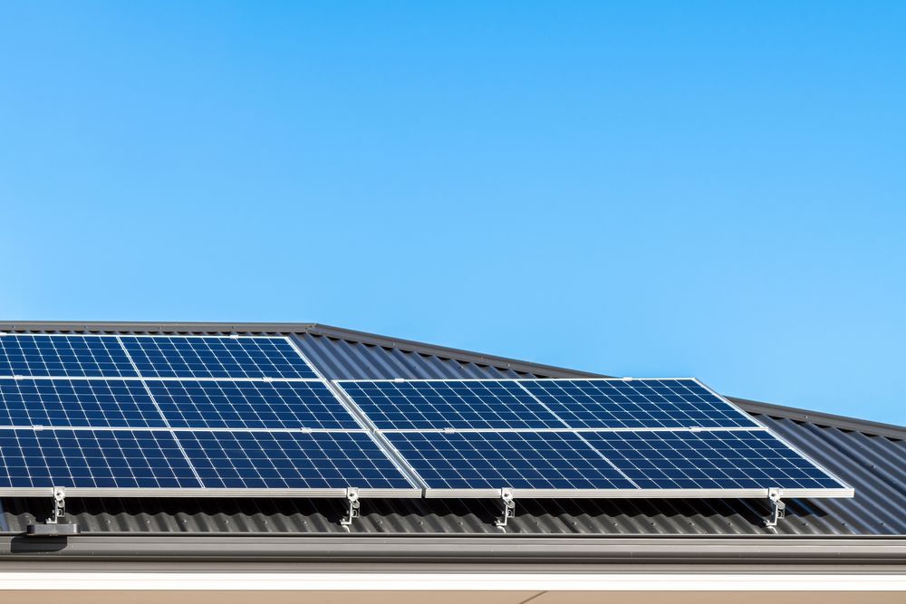 A Kitchen With White Cabinets, Granite Counter Tops and Stainless Steel Appliances — B2B Electrical and Solar In Currimundi, QLD A Kitchen With White Cabinets, Granite Counter Tops — B2B Electrical and Solar In Currimundi, QLD