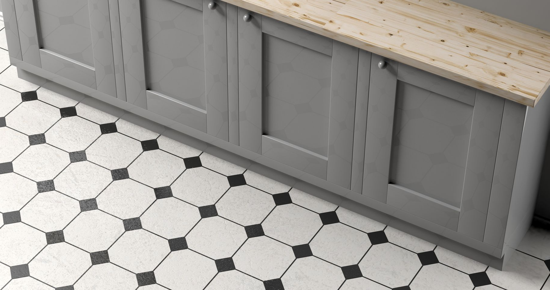 Close-up of a gray cabinet above black and white indoor floor tile.