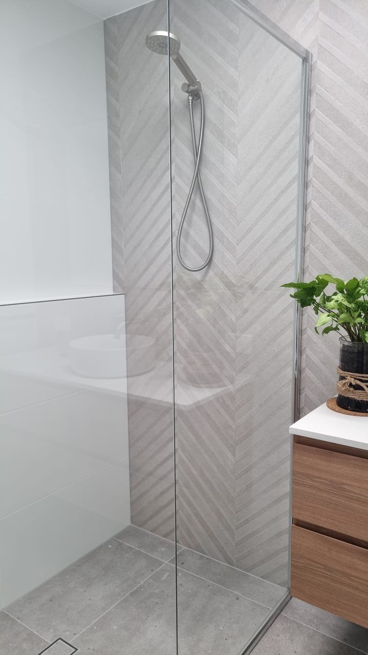 Walls tiles on a Glass door shower bathroom