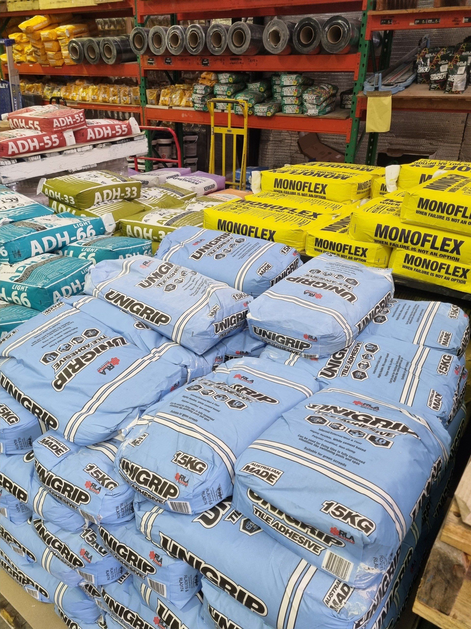 A warehouse filled with lots of bags of cement.