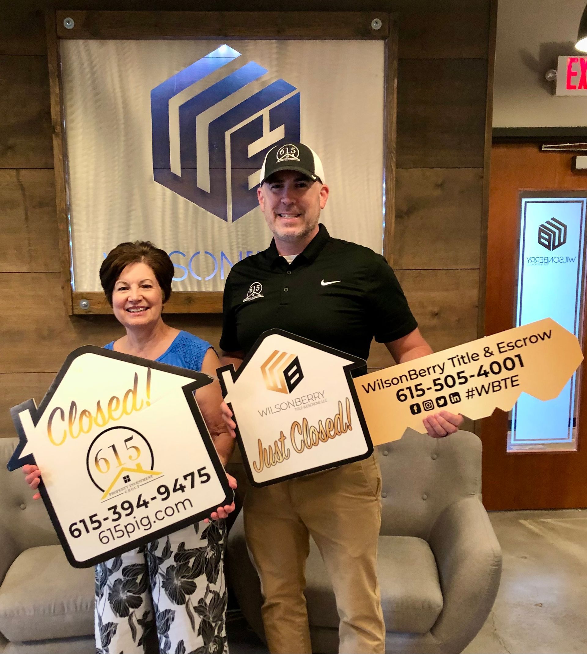 Real estate agent and client holding