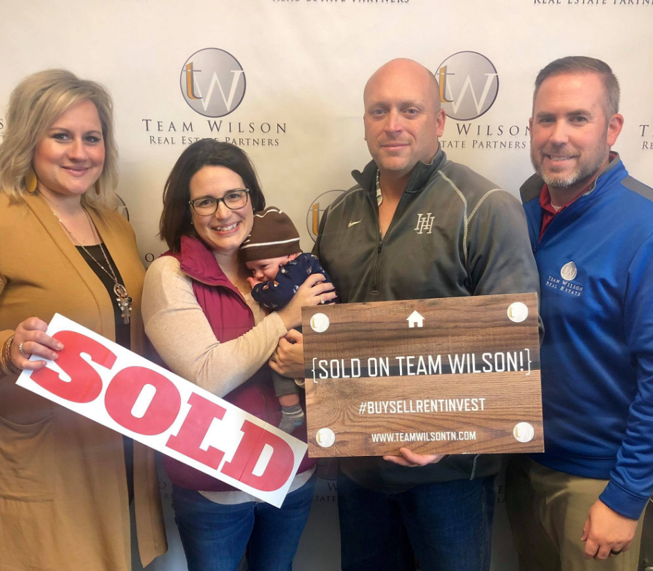 Real estate agents and family holding