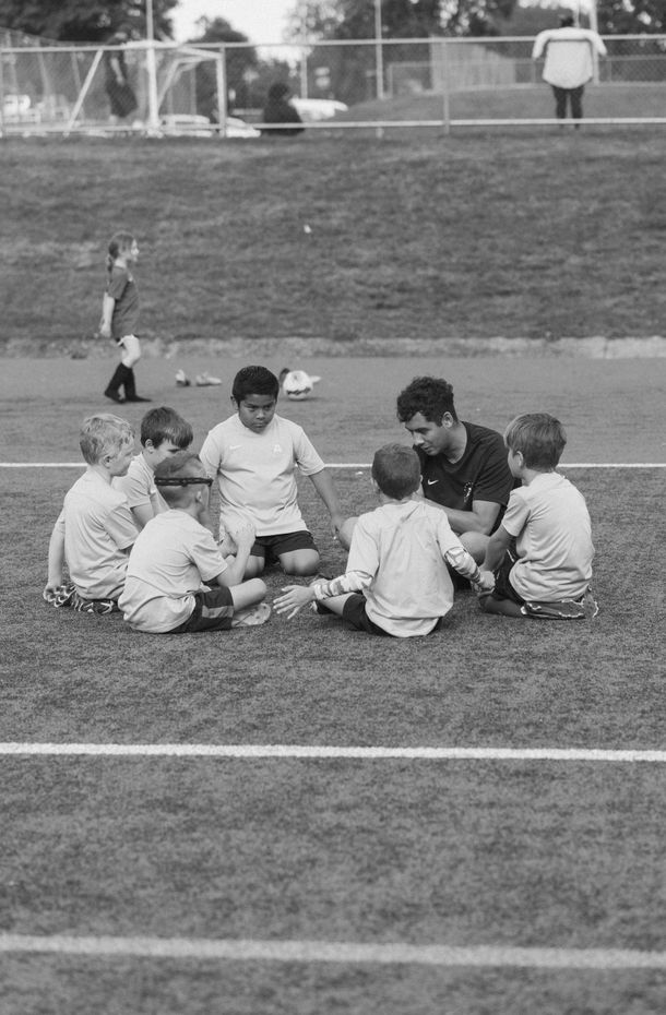 An Advantage Academy team sitting on the field