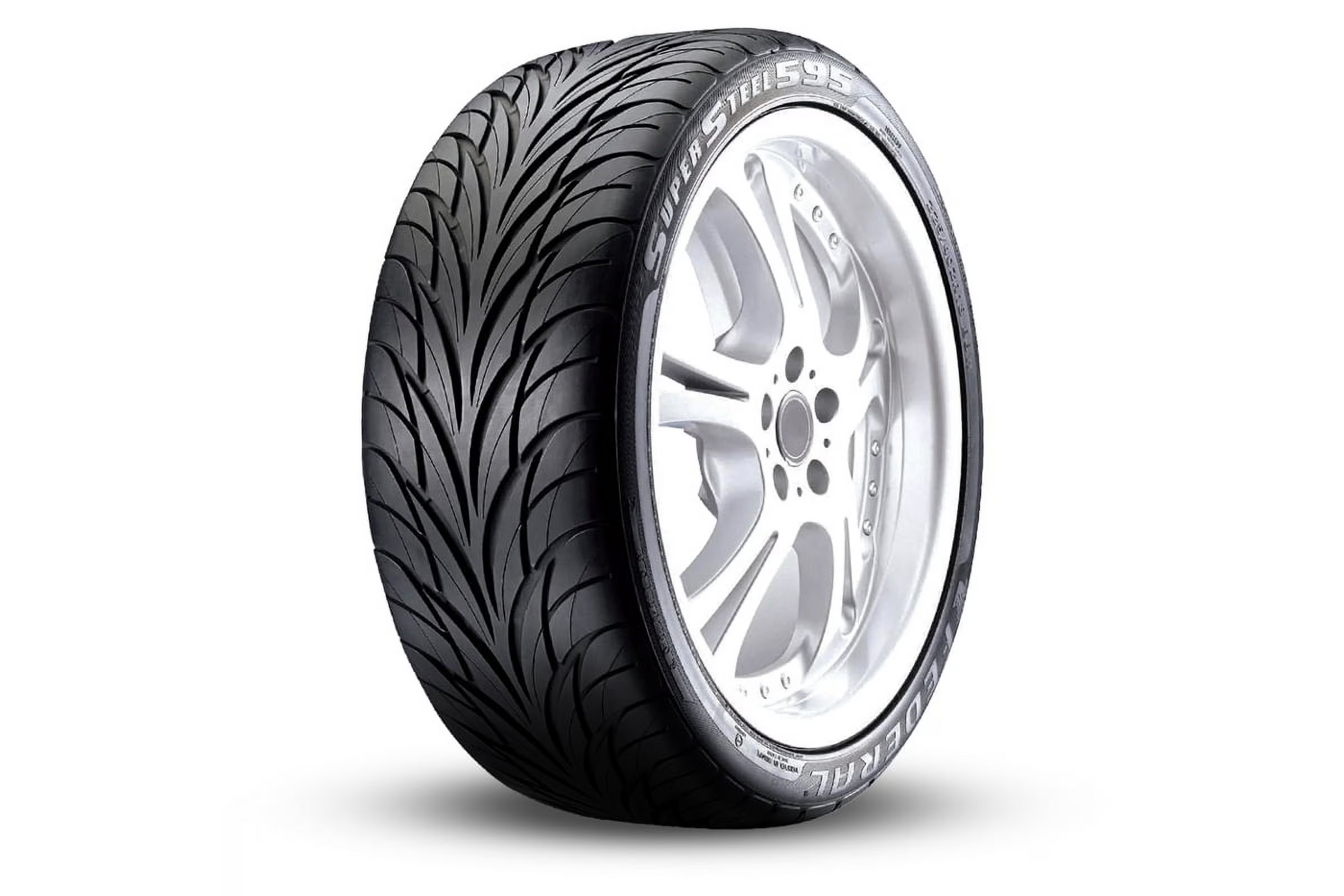 Black tire with angled grooves on a silver rim — Chris Albertini Automotive in North Lismore, NSW