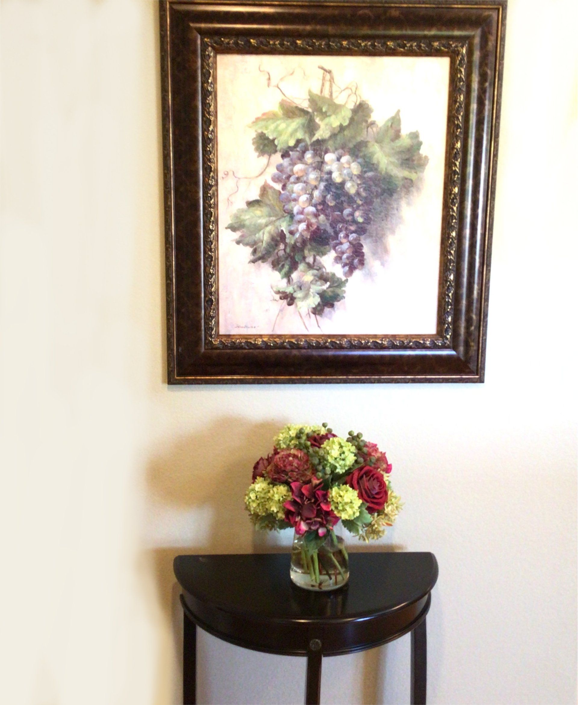 wall with painting and table