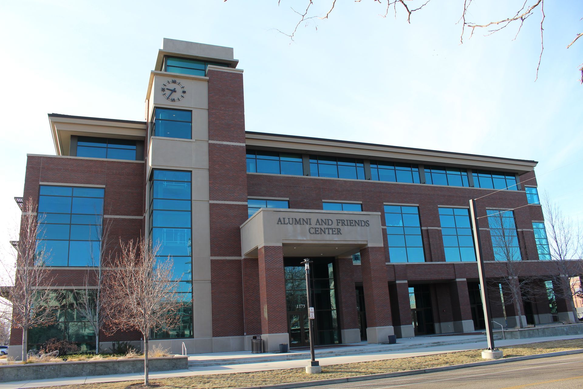A large brick building with a clock on top of it