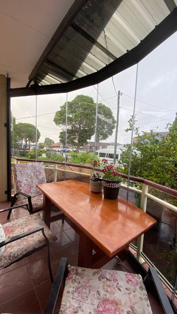 Table and Chair on Balcony — Smithfield, ACT — European Glazing Pty Limited
