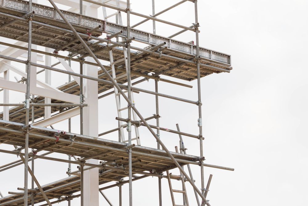 Scaffolding on a Building Under Construction Against a White Sky — NRS Scaffolding Pty Ltd in Taree, NSW