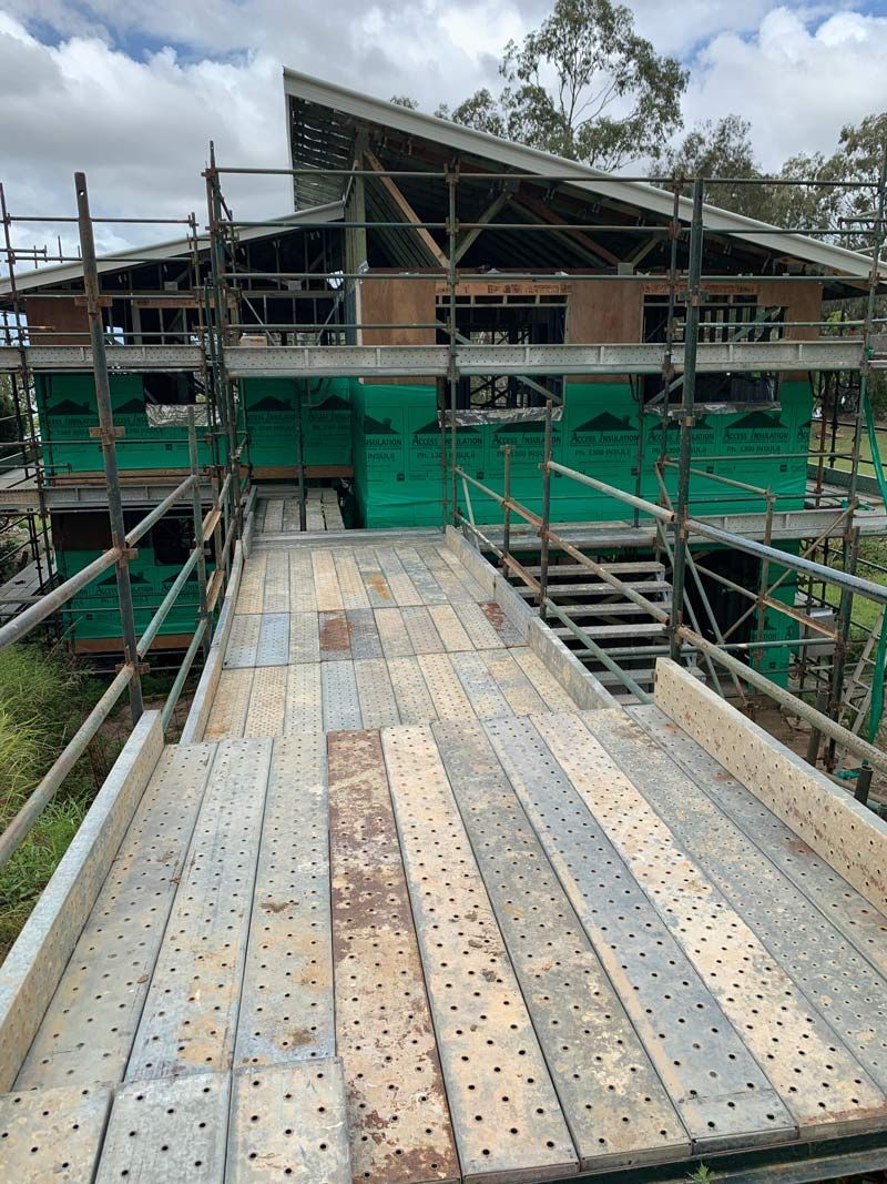 Scaffolding Bridge Going To The Home Under Construction — NRS Scaffolding Pty Ltd In Clifden, NSW