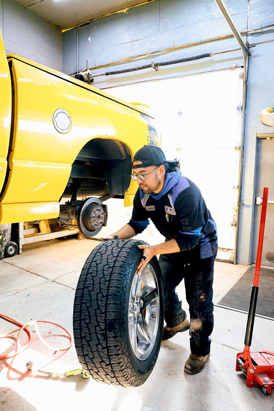 Yellow Truck Being Fixed | L&M Auto Repair