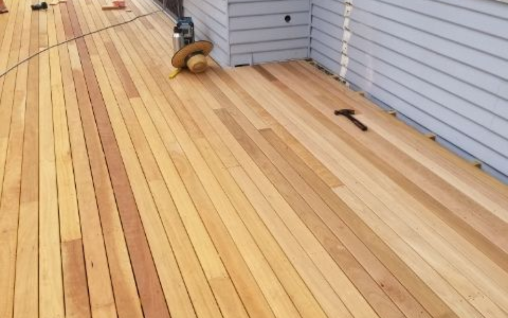A Piece Of Wood Is Sitting On A White Surface — Machin's Sawmill Pty Ltd In Wingham, NSW
