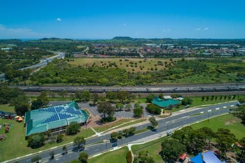 Aerial View of a Park With a Train Going by — BJ's Concreting in Callala Bay, NSW