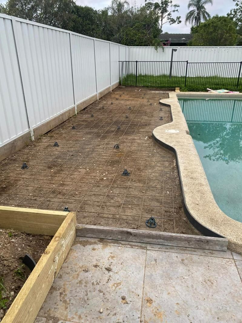 Swimming Pool is Being Built in the Backyard of a House — BJ's Concreting in Bomaderry, NSW