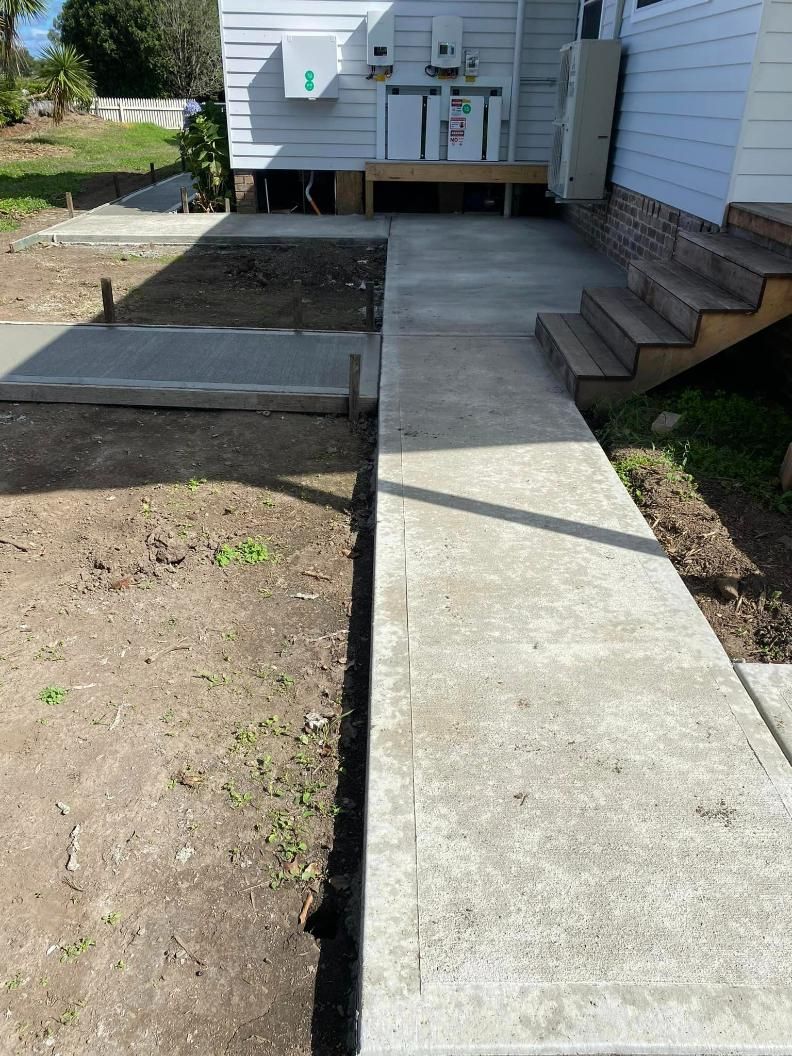 Concrete Walkway Leading to a House With Stairs — BJ's Concreting in Callala Bay, NSW