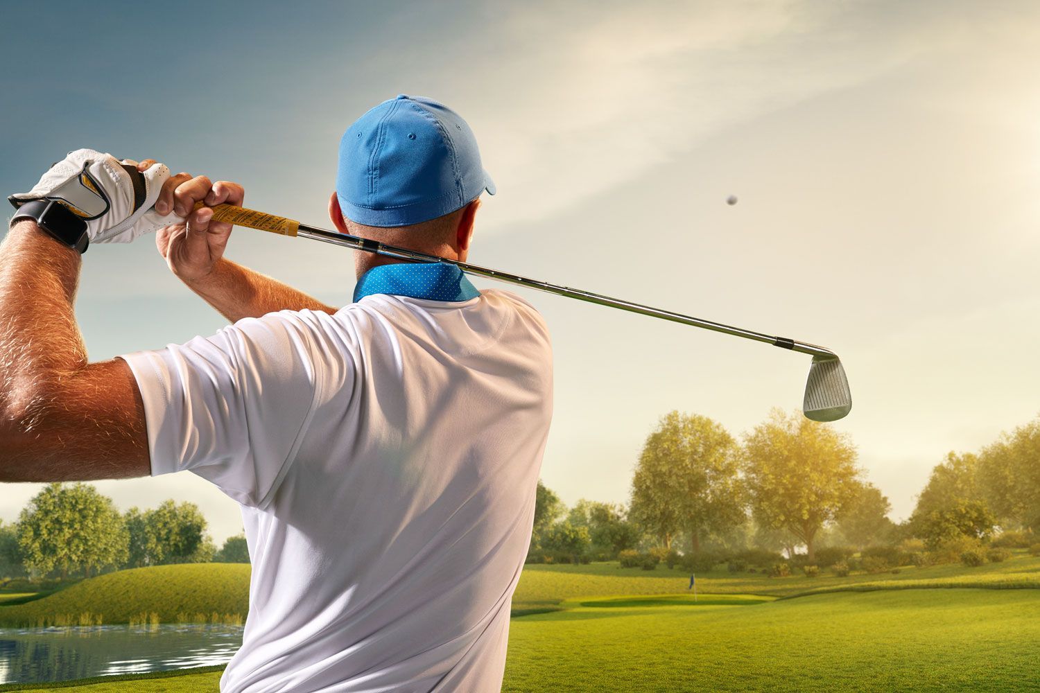 Golfer with golf club taking a shot