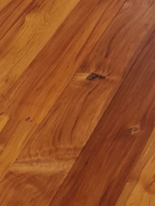 A close up of a wooden floor with a lot of grain.
