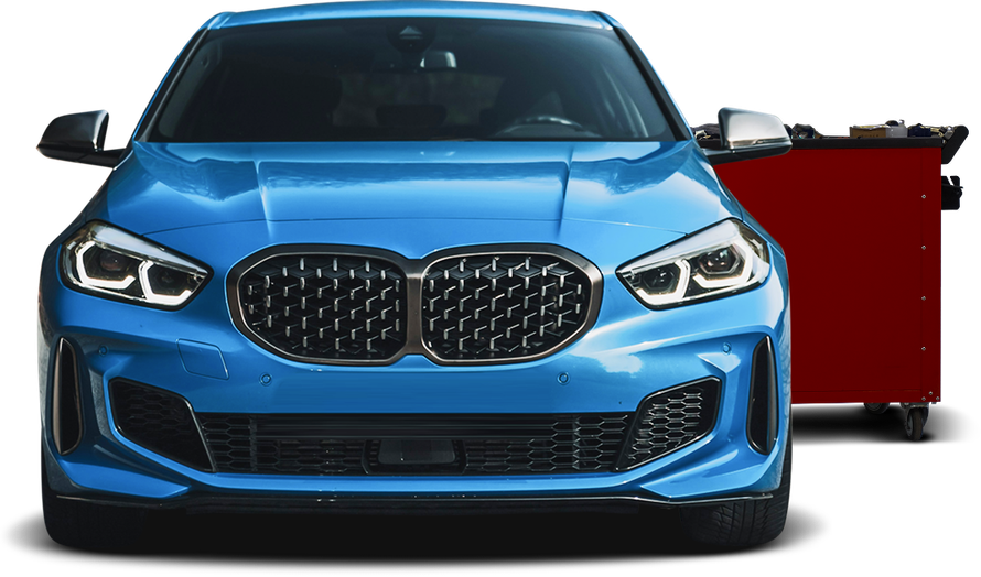 Blue BMW in front of a red tool chest. | Allroad Motorsports