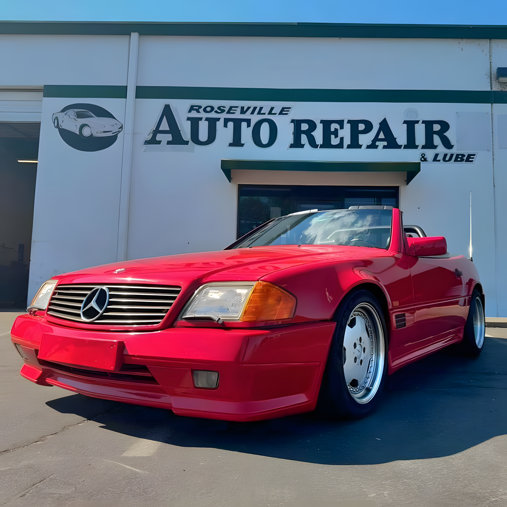 Red Mercedes convertible in front of Roseville Auto Repair building | Freebird Automotive