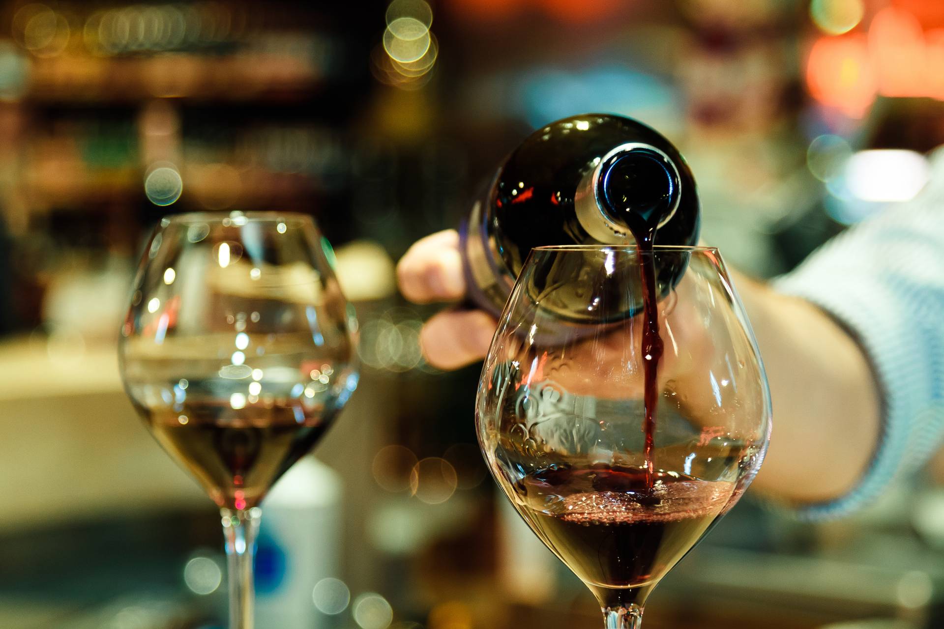 woman pouring wine