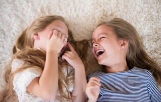Two Girls Laughing — Carpets in Mahomet, IL