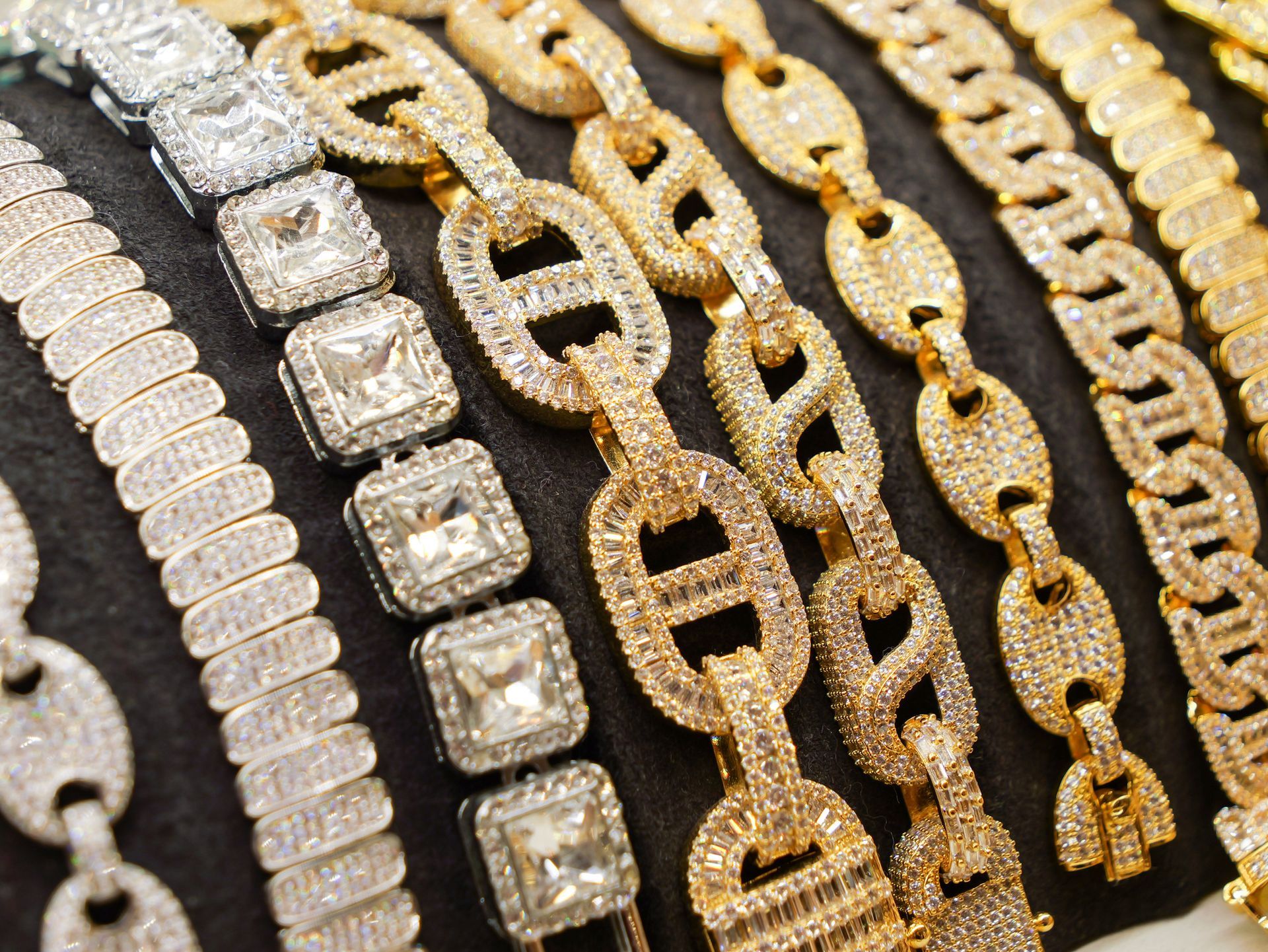 A bunch of gold chains with diamonds on them