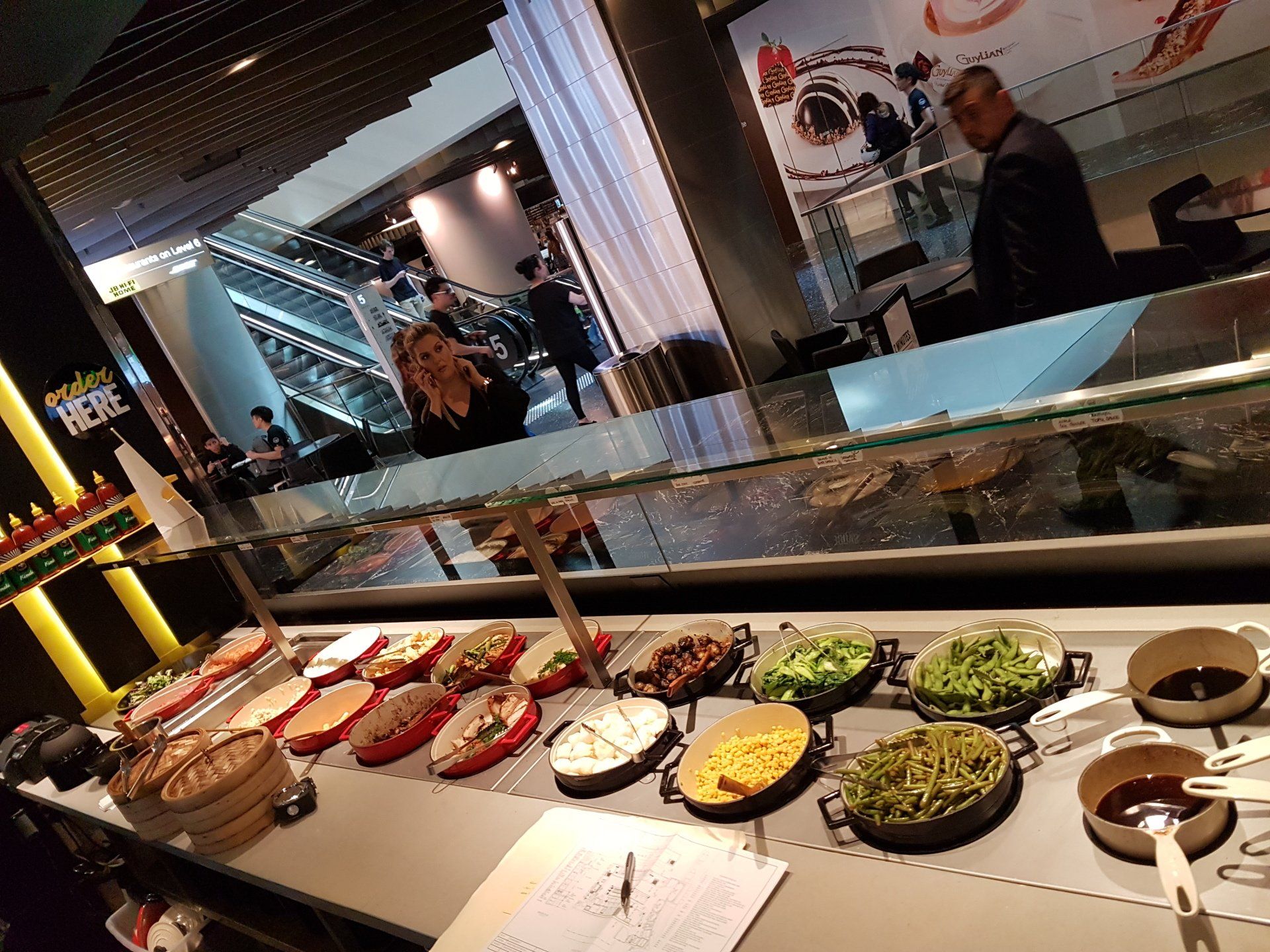 A buffet with a lot of food on it in a restaurant