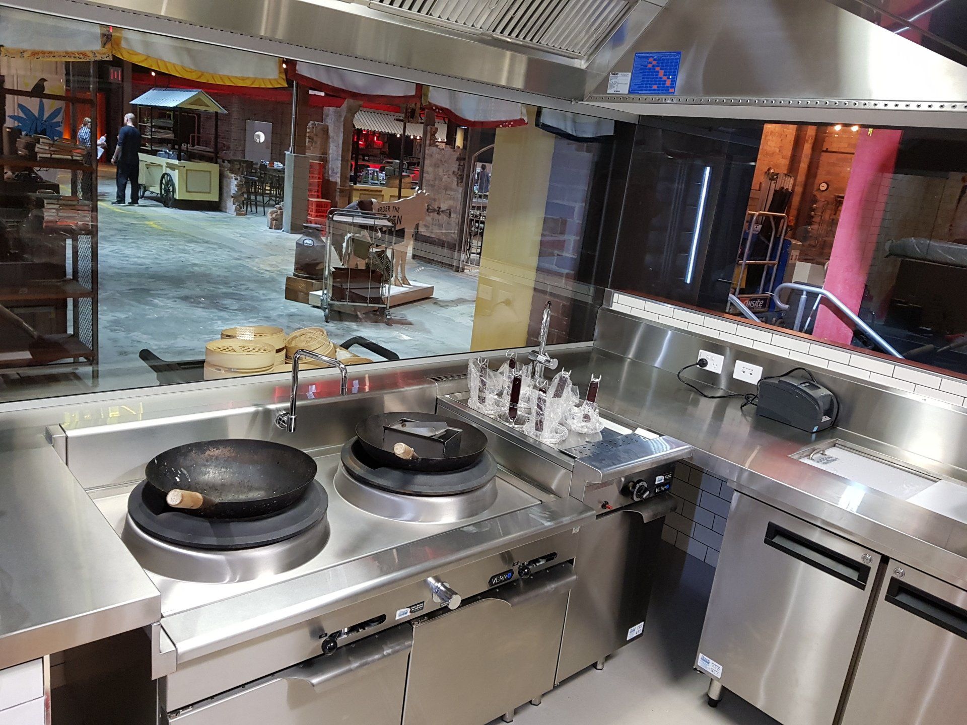 A kitchen with a lot of stainless steel appliances