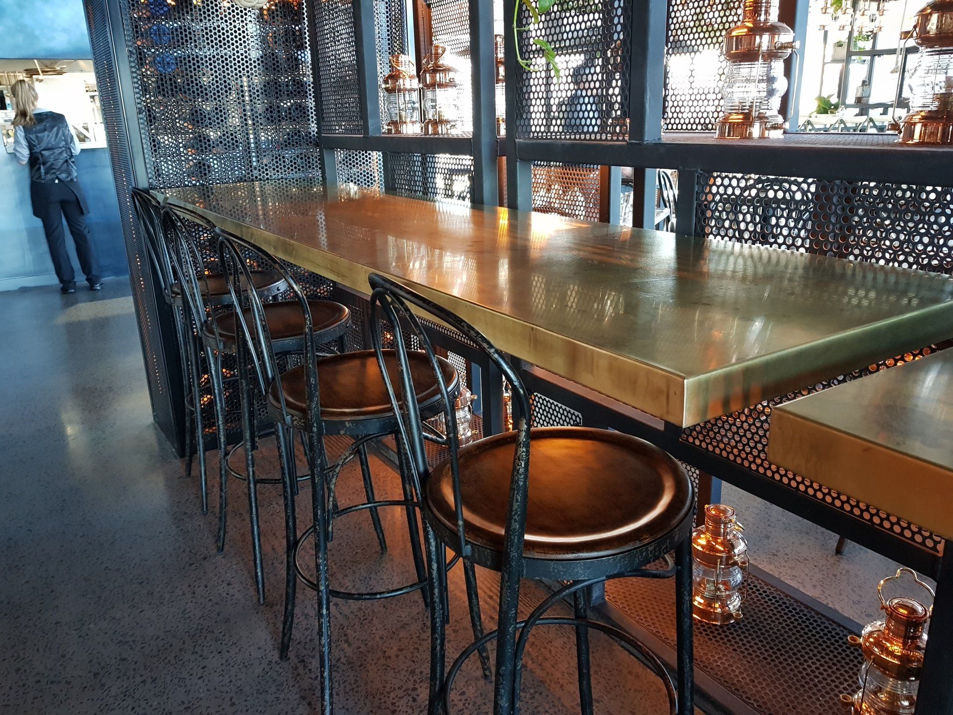 A row of tables and chairs in a restaurant