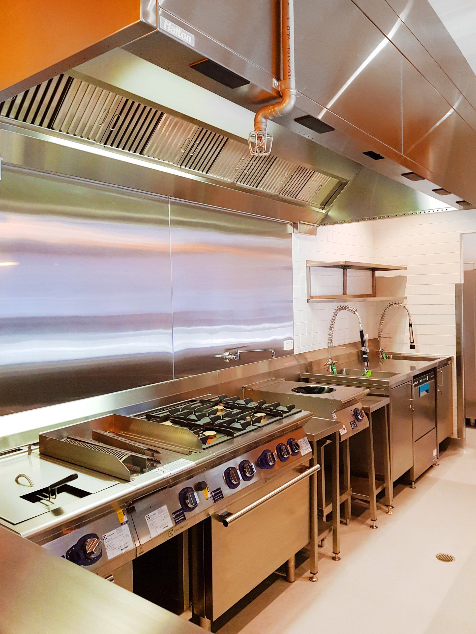 A kitchen with a lot of stainless steel appliances