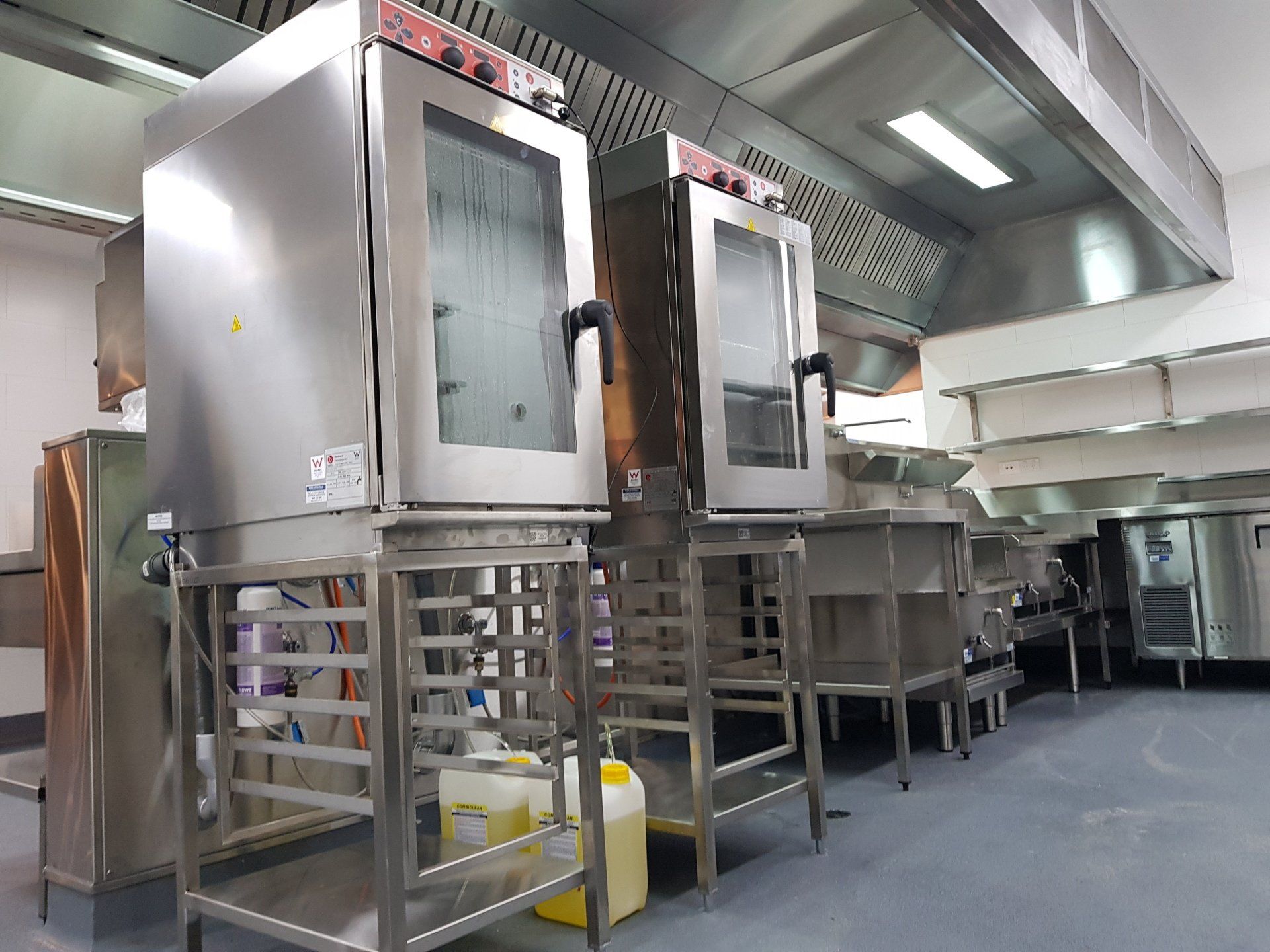 A kitchen with a lot of stainless steel appliances.