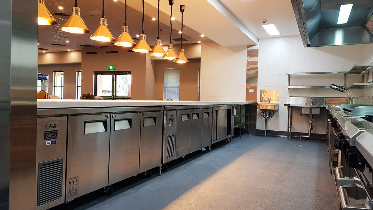 A kitchen with a lot of stainless steel appliances