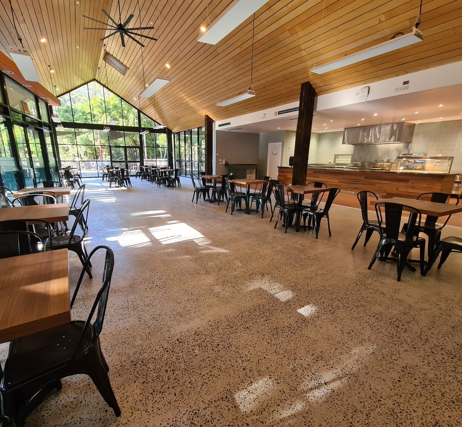 A large room with tables and chairs in it