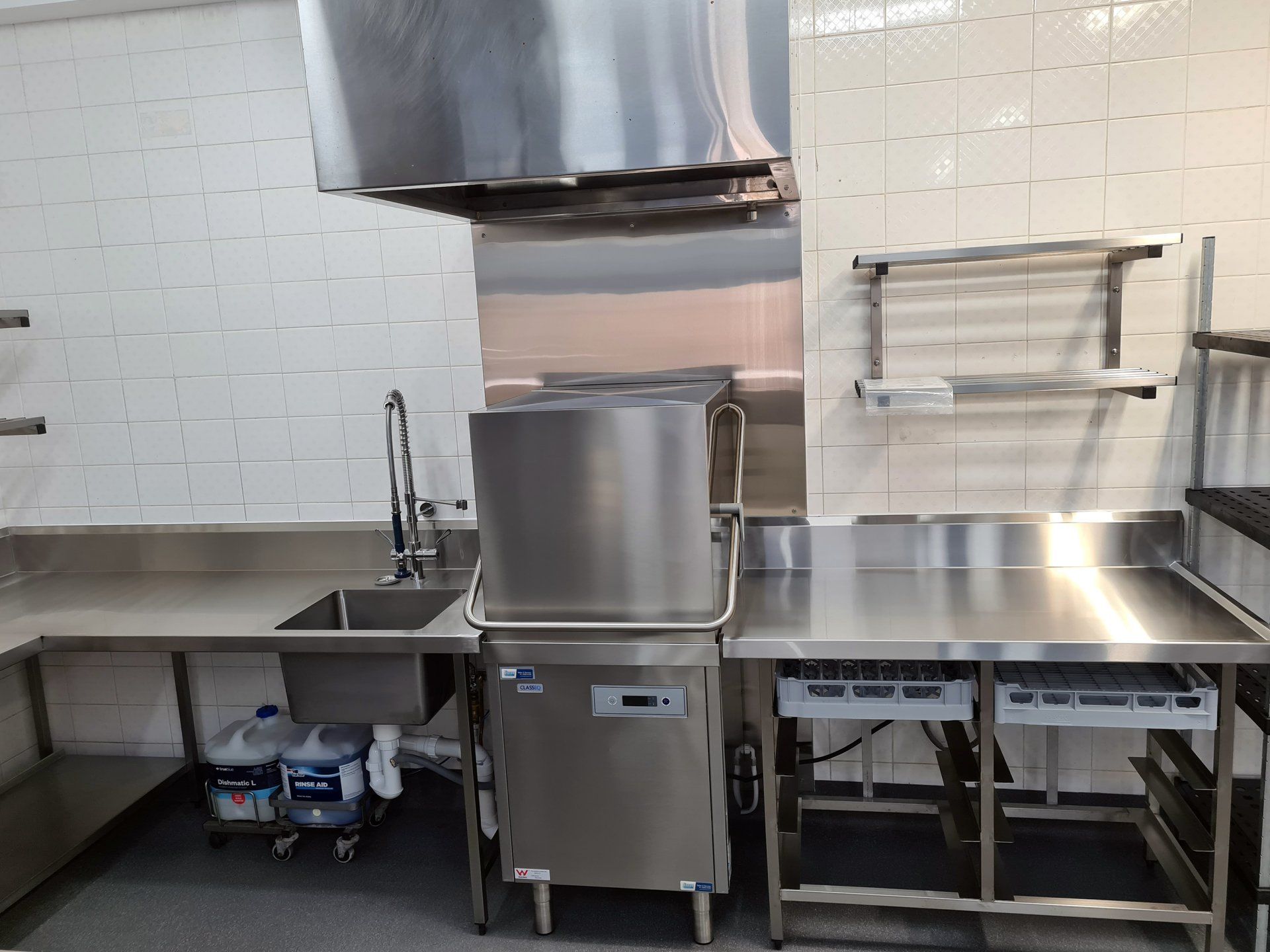 A kitchen with stainless steel appliances and a sink