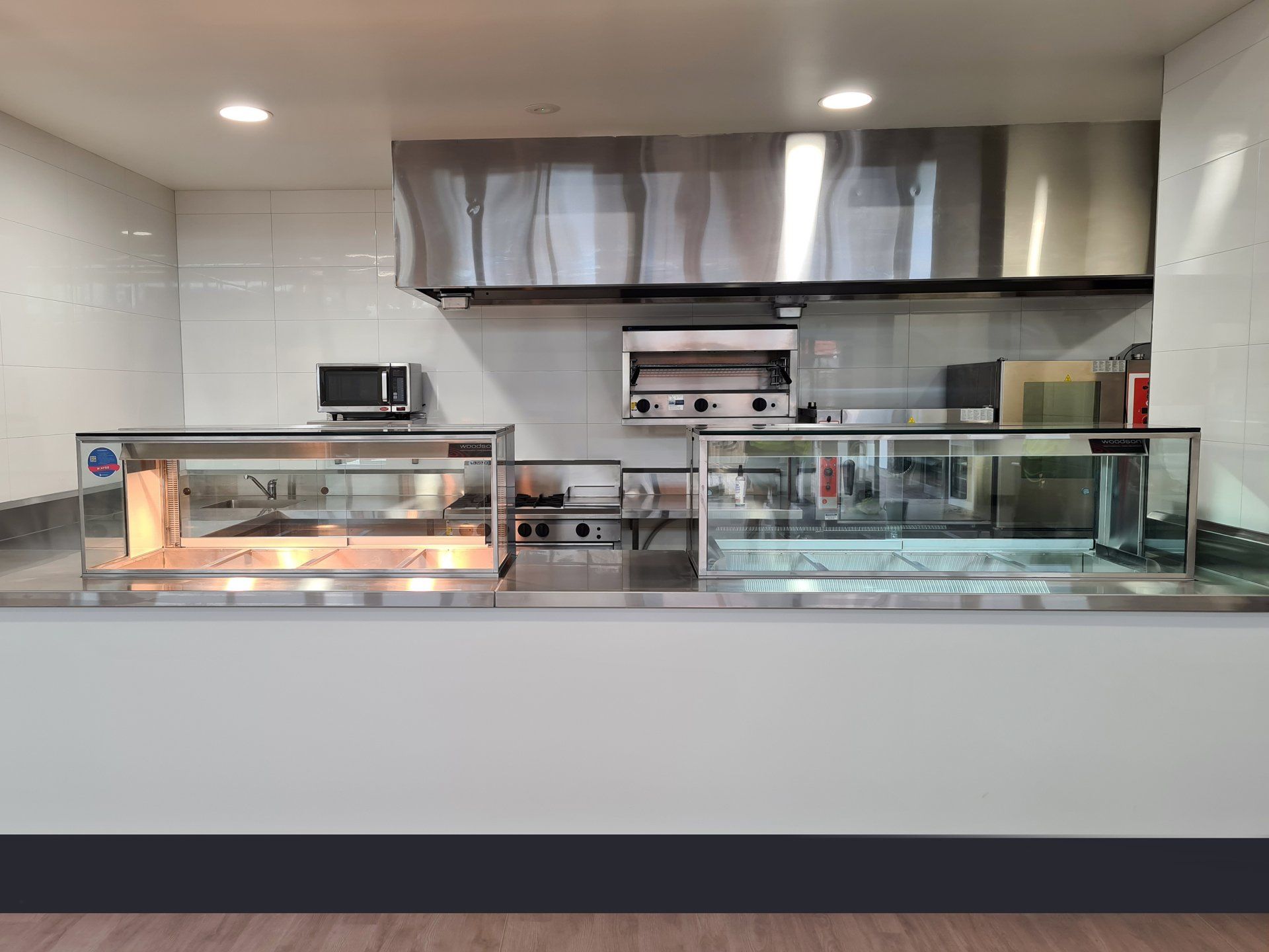 A kitchen with stainless steel appliances and a counter.