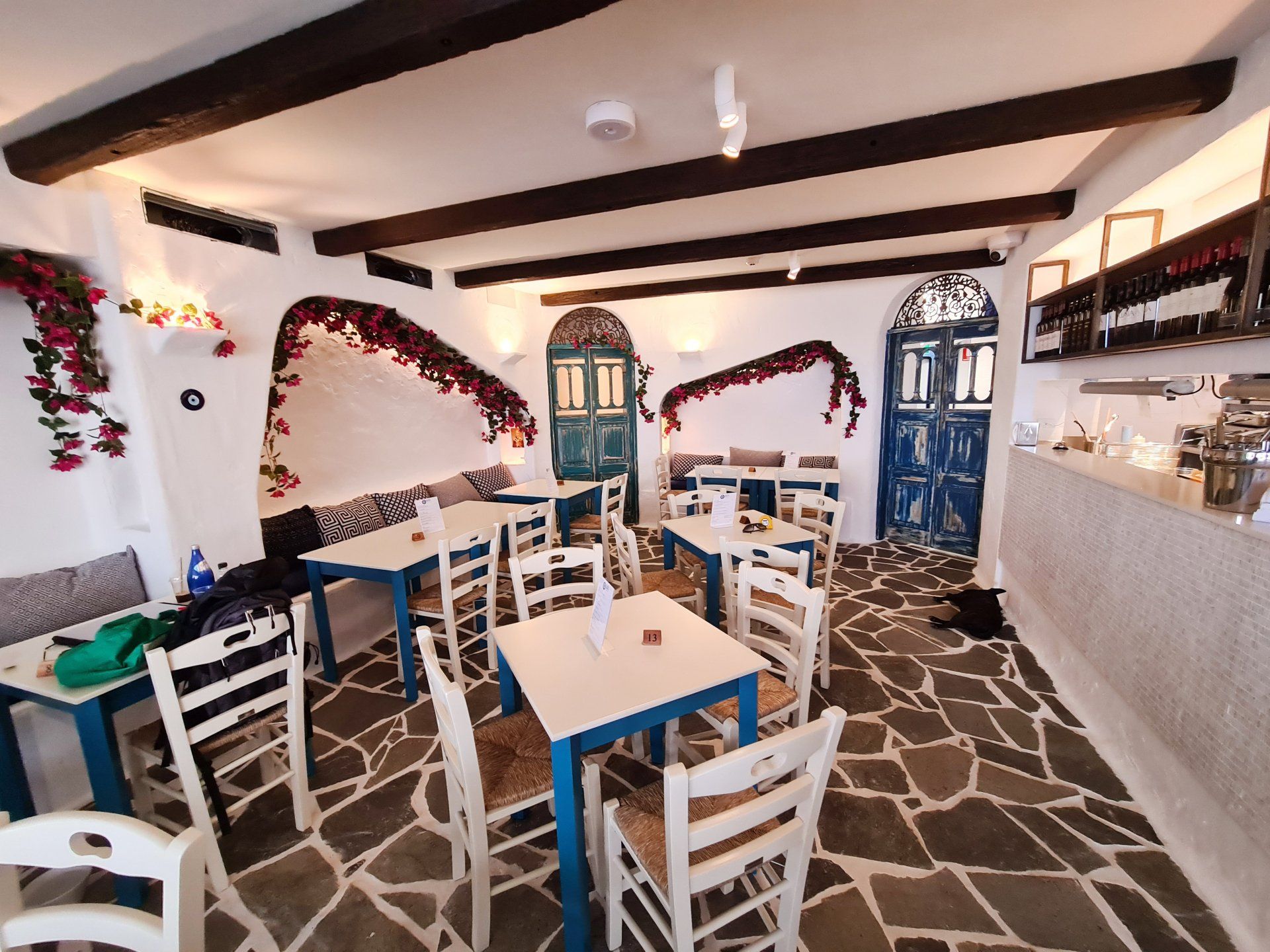 A restaurant with tables and chairs and a bar