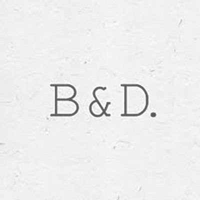 A white background with the words `` b & d '' written on it.