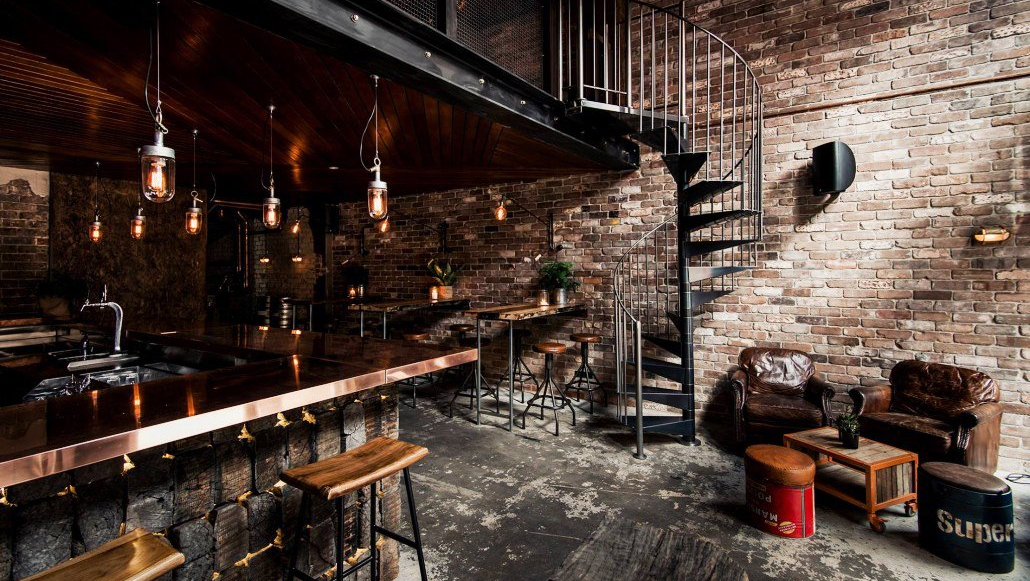 There is a spiral staircase in the middle of the room.