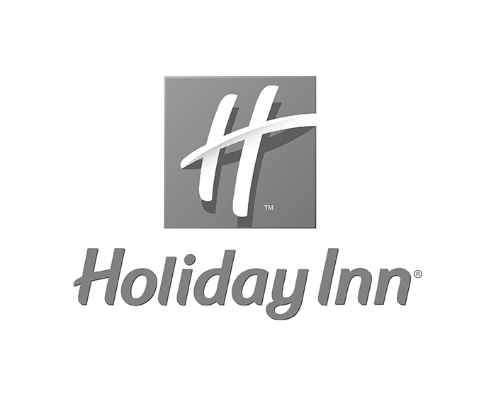 The holiday inn logo is black and white and looks like a cross.