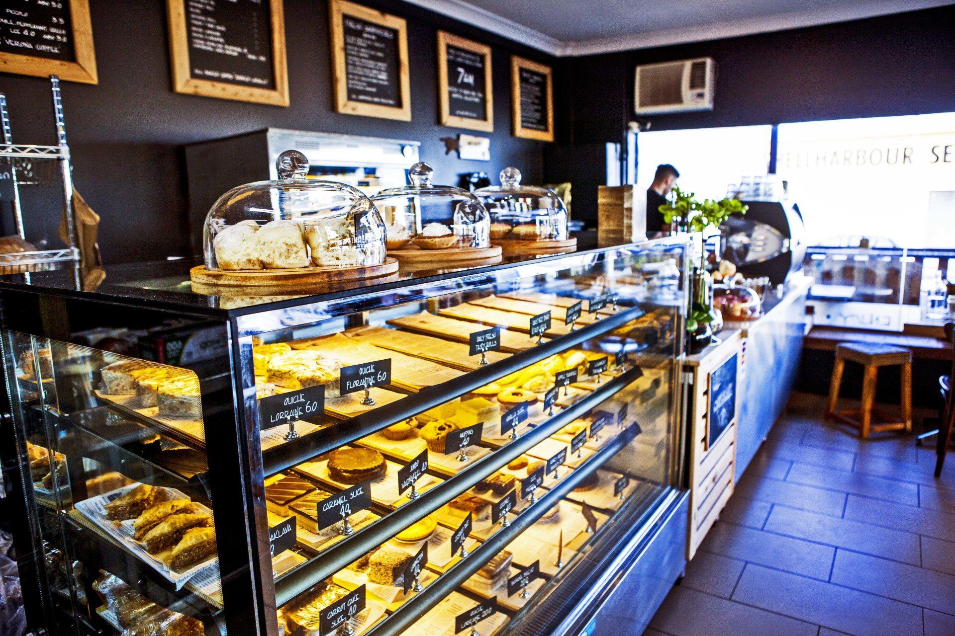 A bakery with a lot of food in the display case