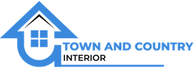 A logo for town and country interior with a house on it