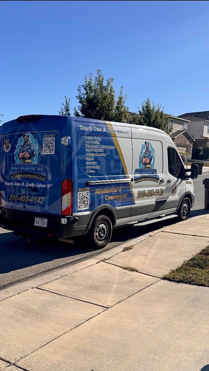 Red and green valves with pipes in a utility room setting.