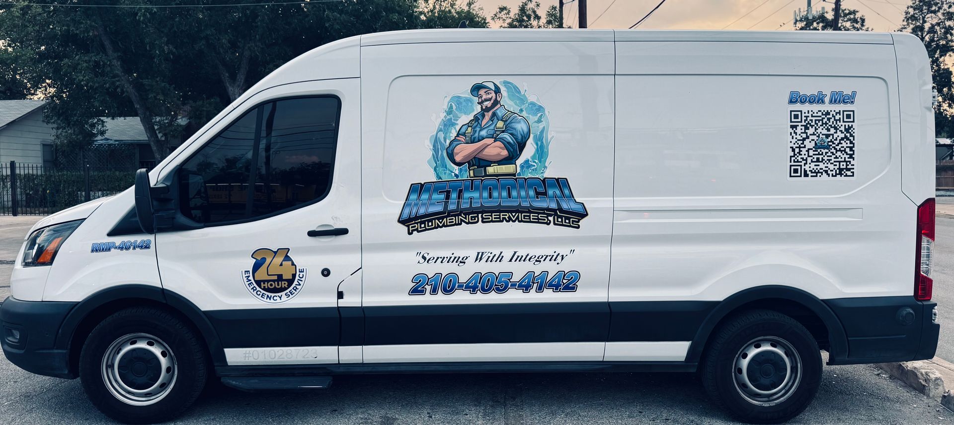 Red and green valves with pipes in a utility room setting.