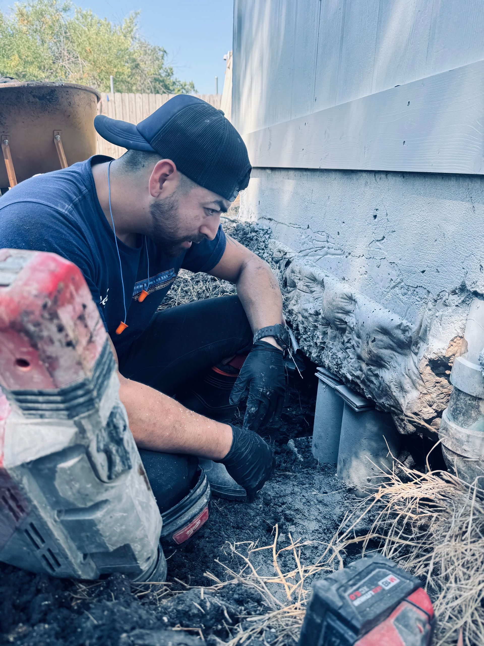 Pressure gauge connected to plumbing with a ball valve. Red needle points to around 3.