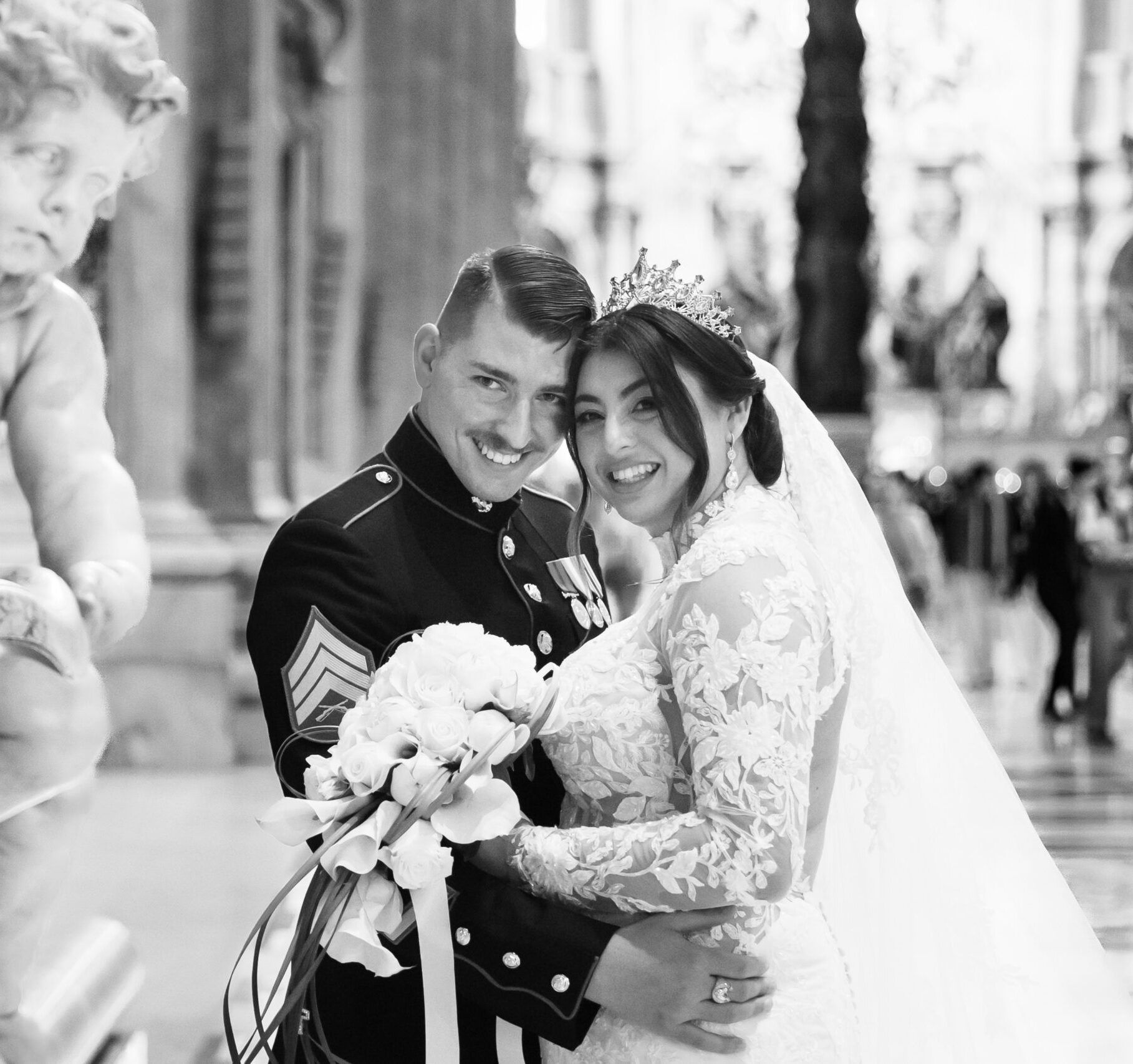 A black and white photo of a bride and groom posing for a picture.