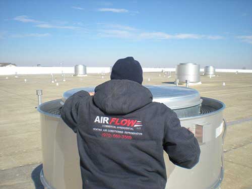 Man on roof - Air Flow in Loveland, CO